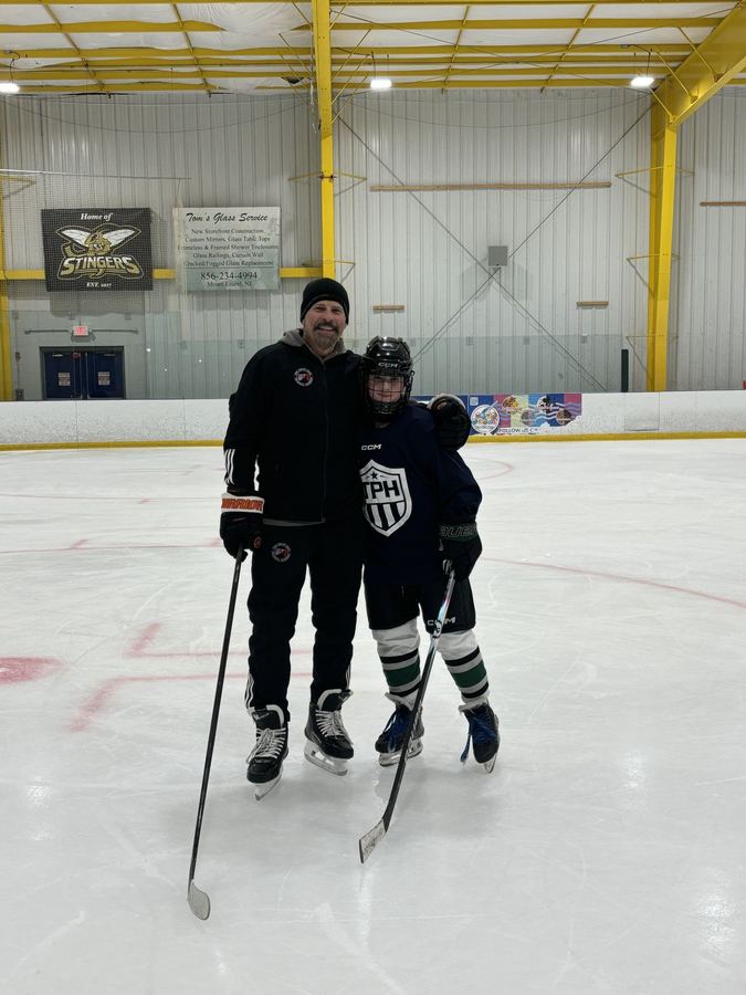 Bella with coach Lloyd Eisler on the ice